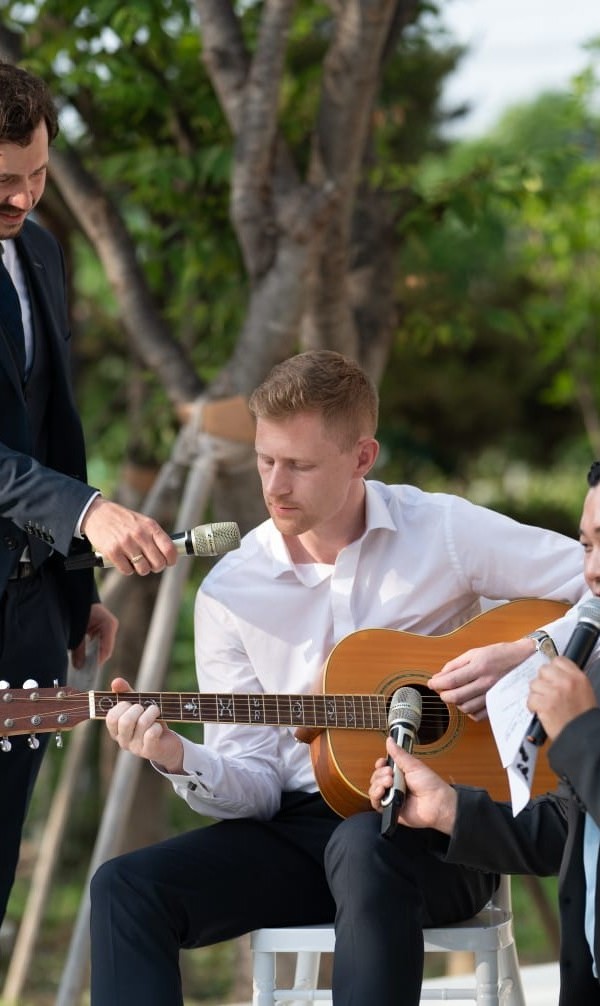 Seán playing acoustic guitar outdoors